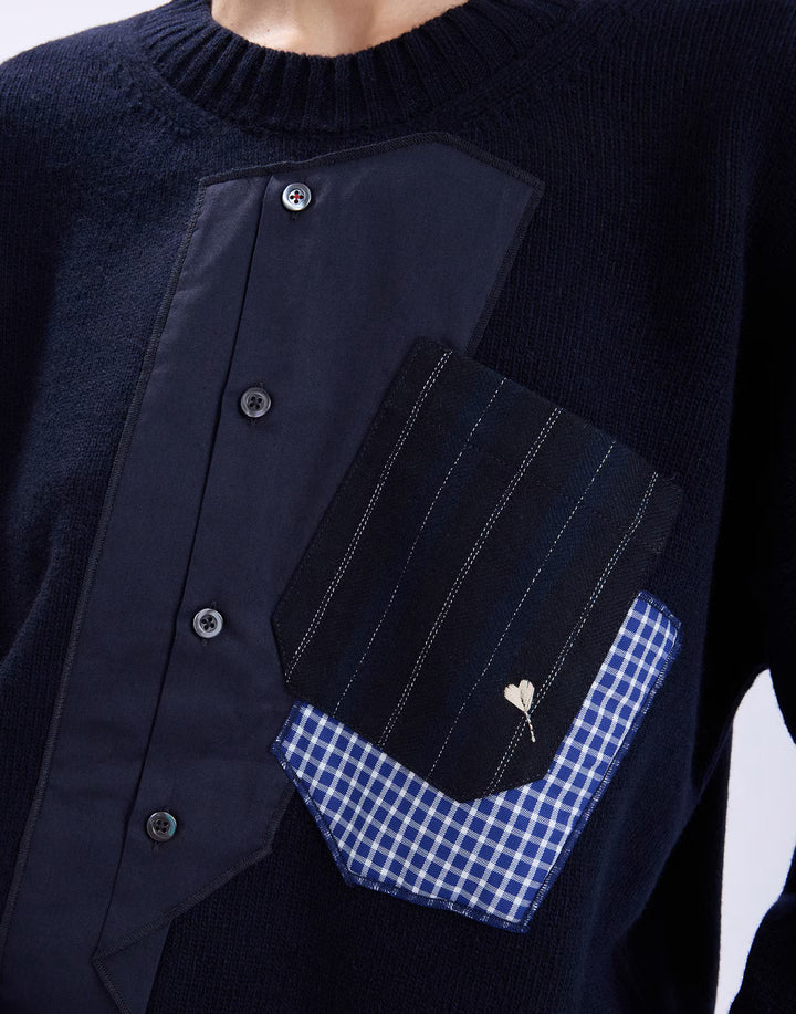 Close-up of the HIGH Casually sweater showing the shirt placket, pinstripe pocket, gingham trim and heart pin detail