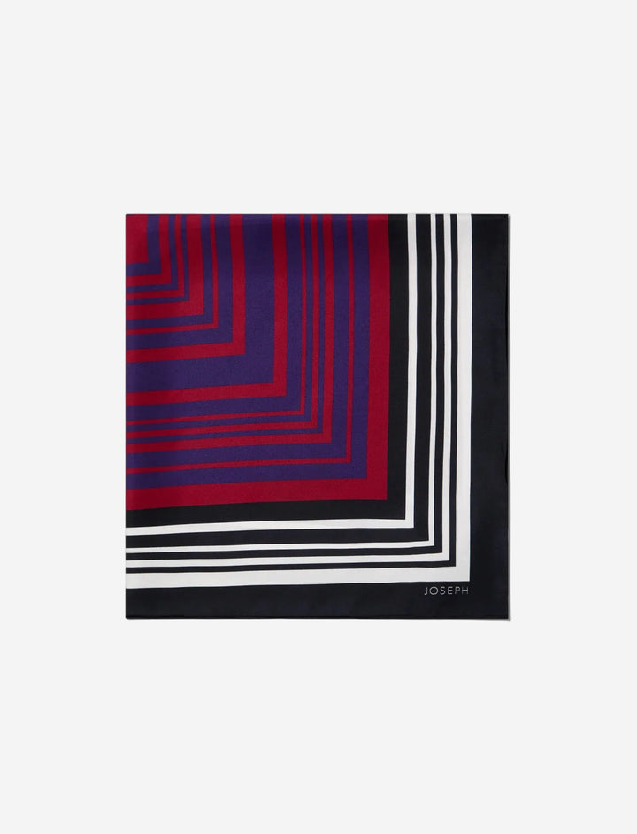 Square scarf with red, blue, and black geometric pattern on a white background