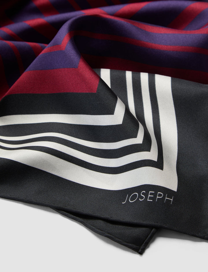 Striped scarf with 'JOSEPH' branding on a white background