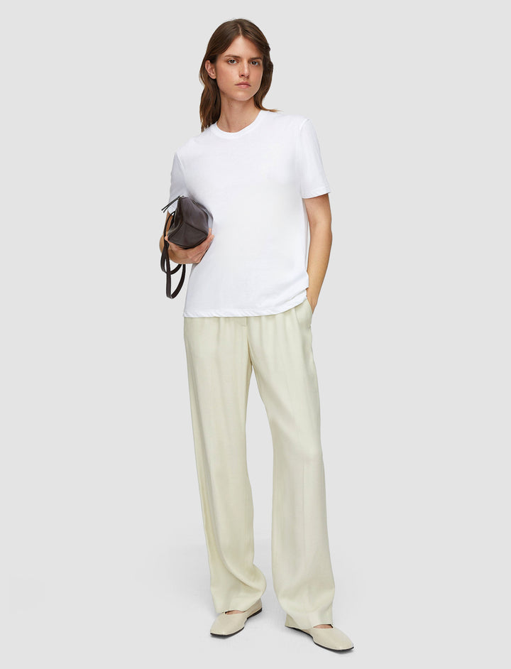 Model in white Joseph T-shirt
