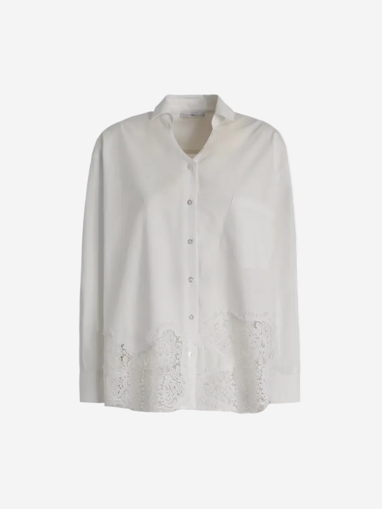 White blouse with lace details on a white background