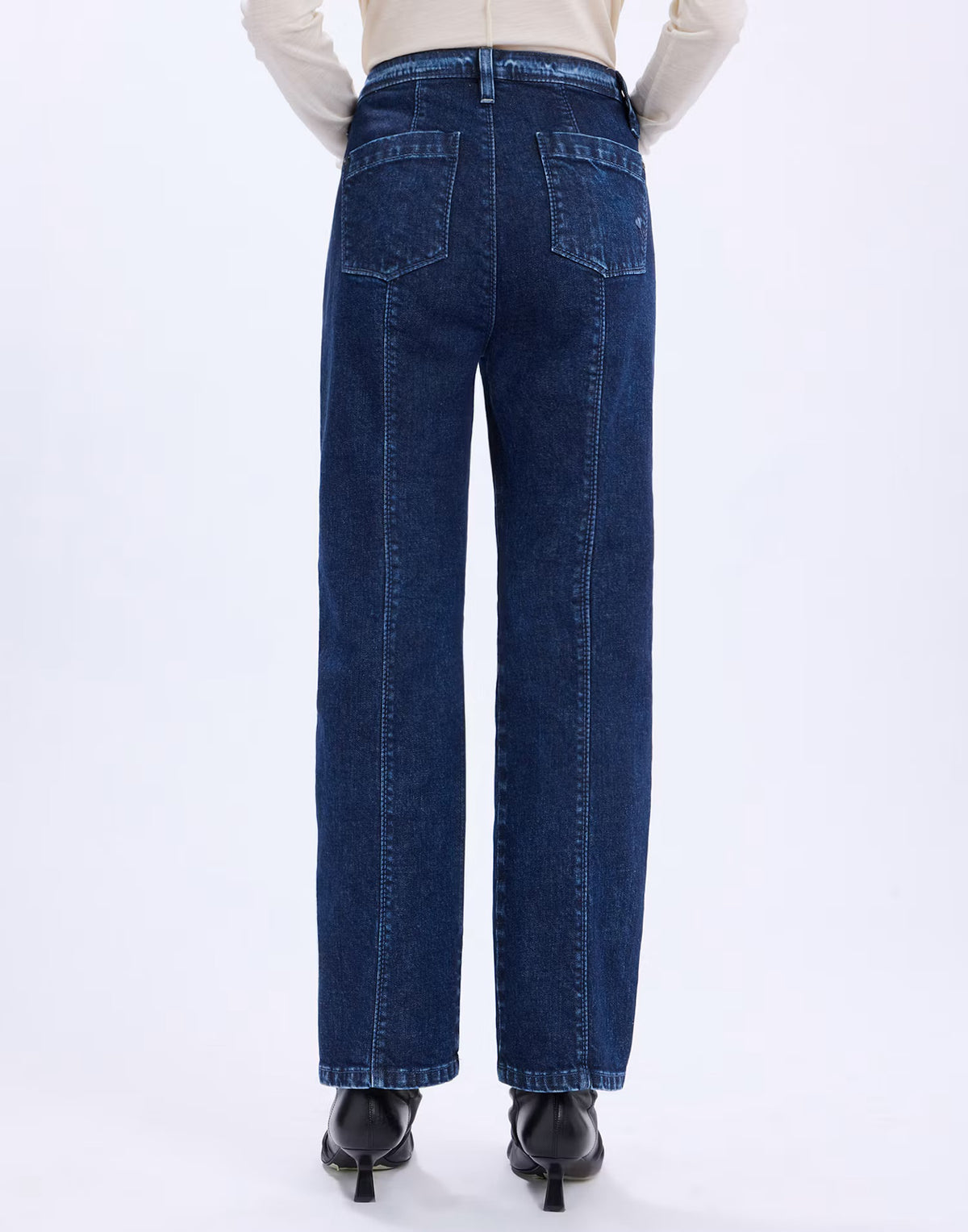 Back view of the HIGH Fairness jeans in blue denim showing the back pockets and centre seams