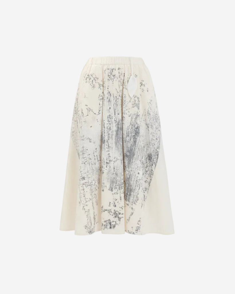 White skirt with black floral pattern on a white background