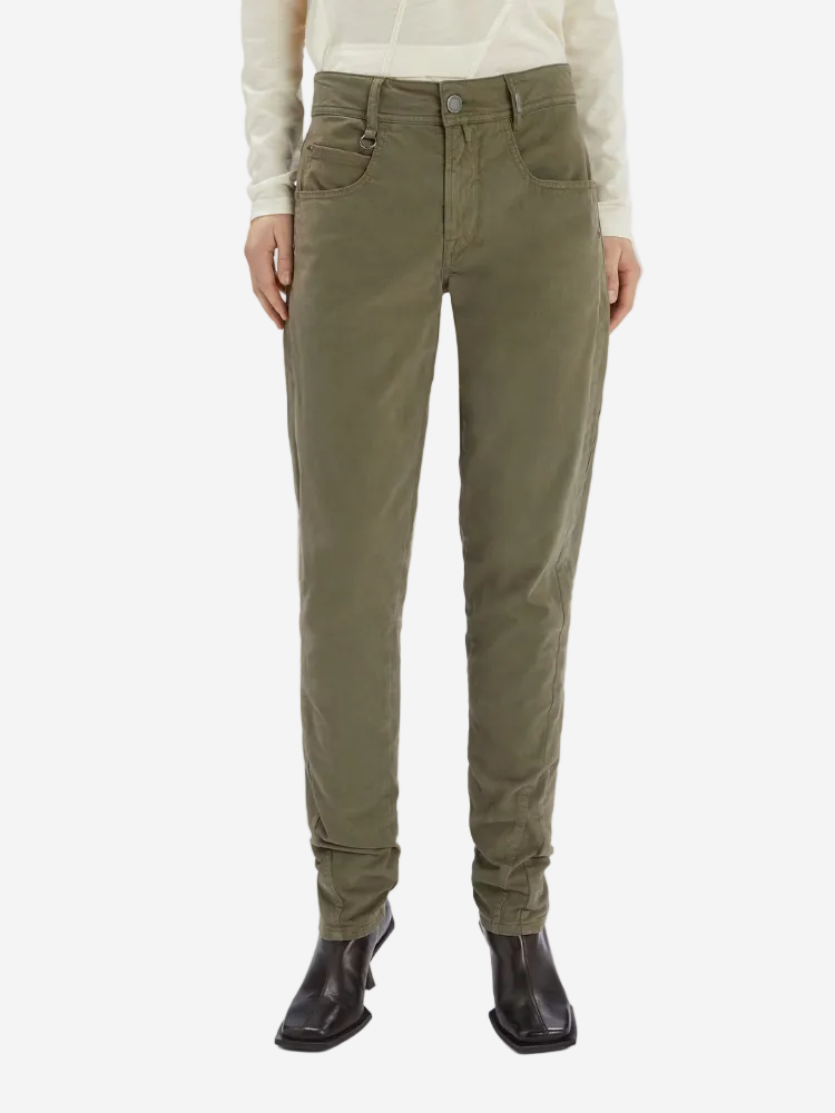 Person wearing olive green pants on a white background