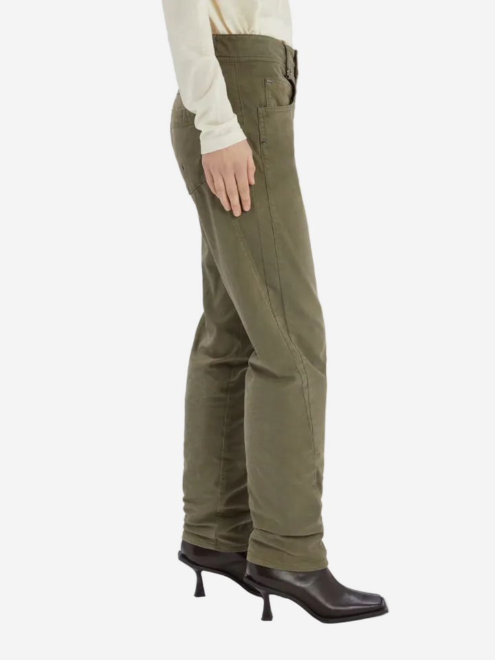 Person wearing olive green pants on a white background