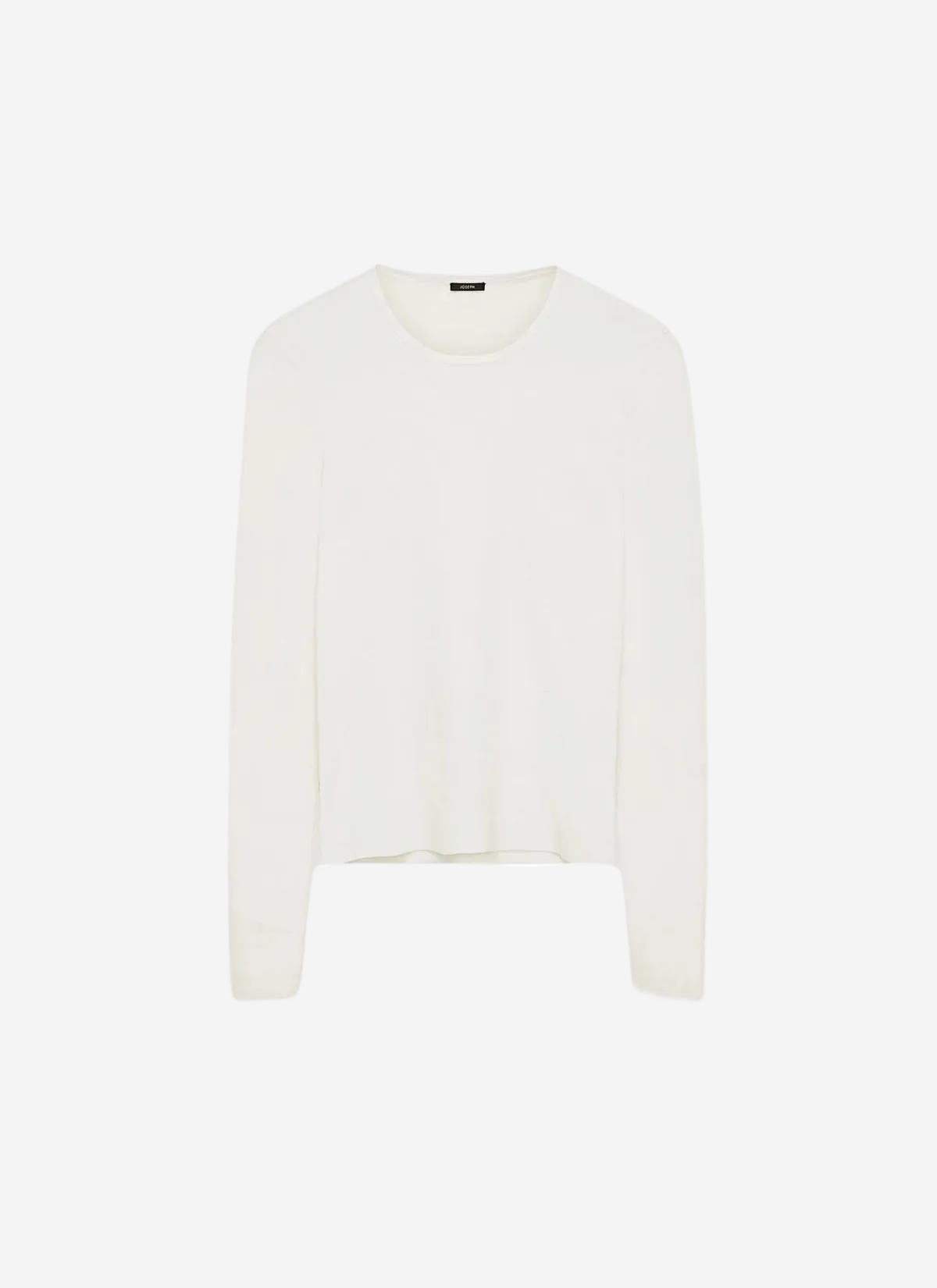 White sweater on a light beige background