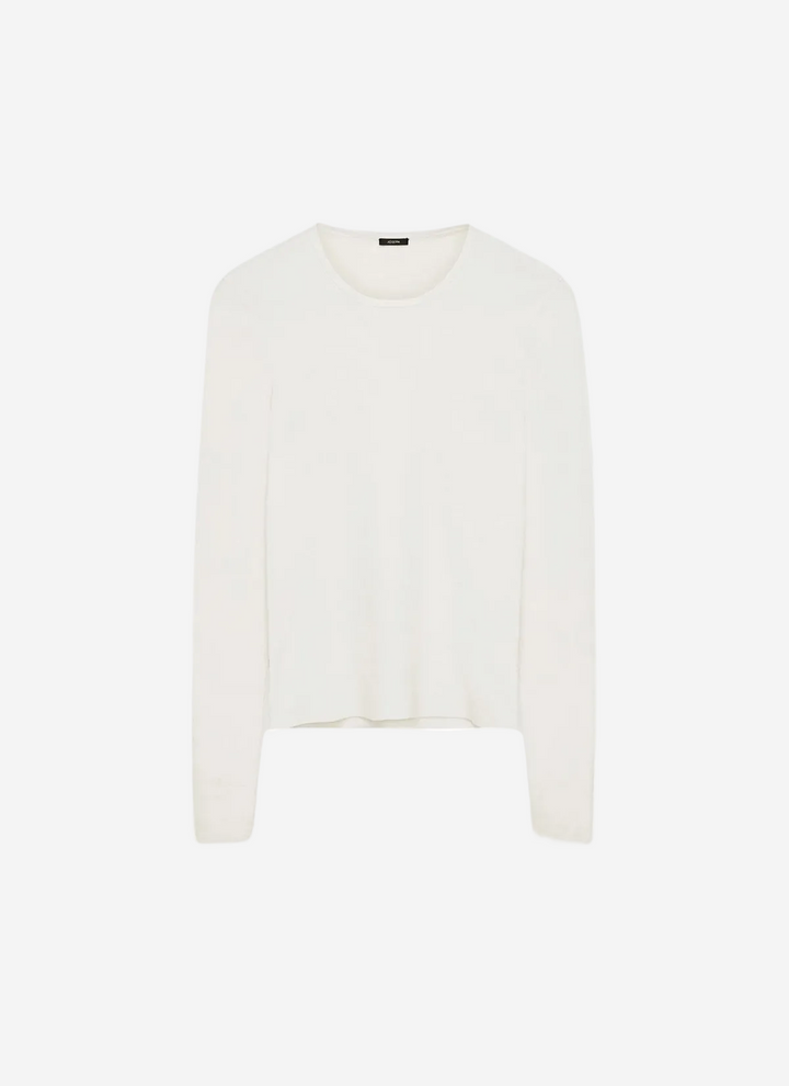 White sweater on a light beige background