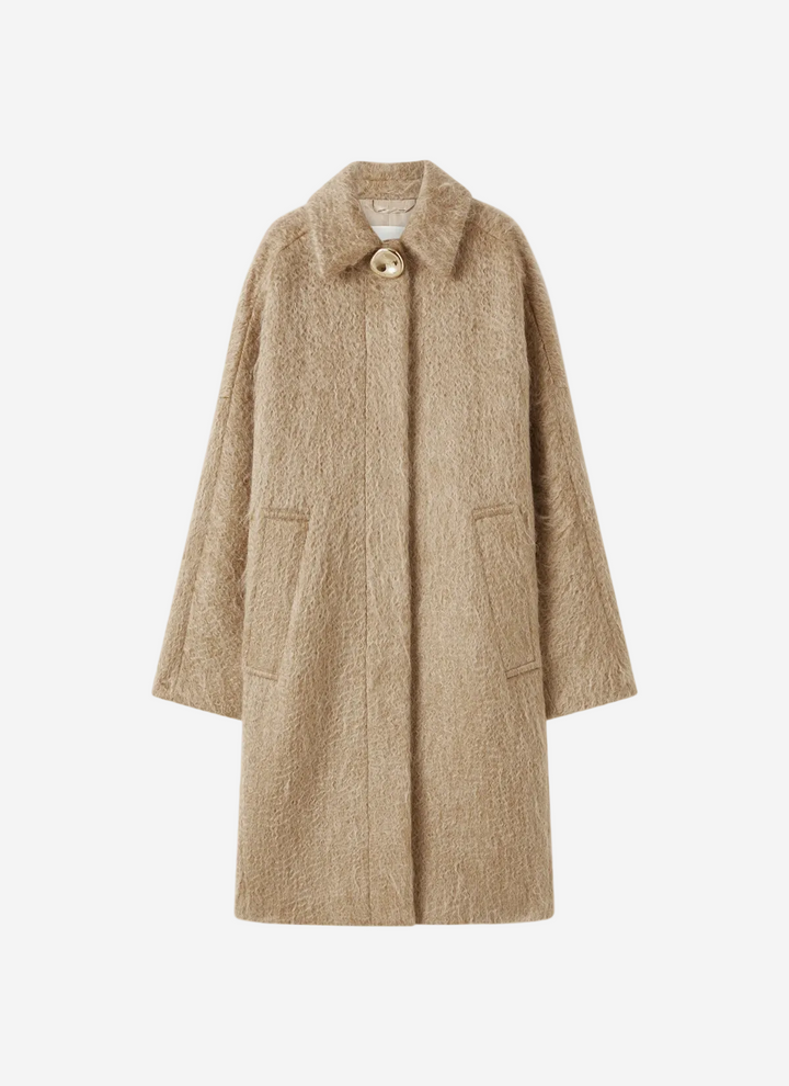 Beige coat on a white background