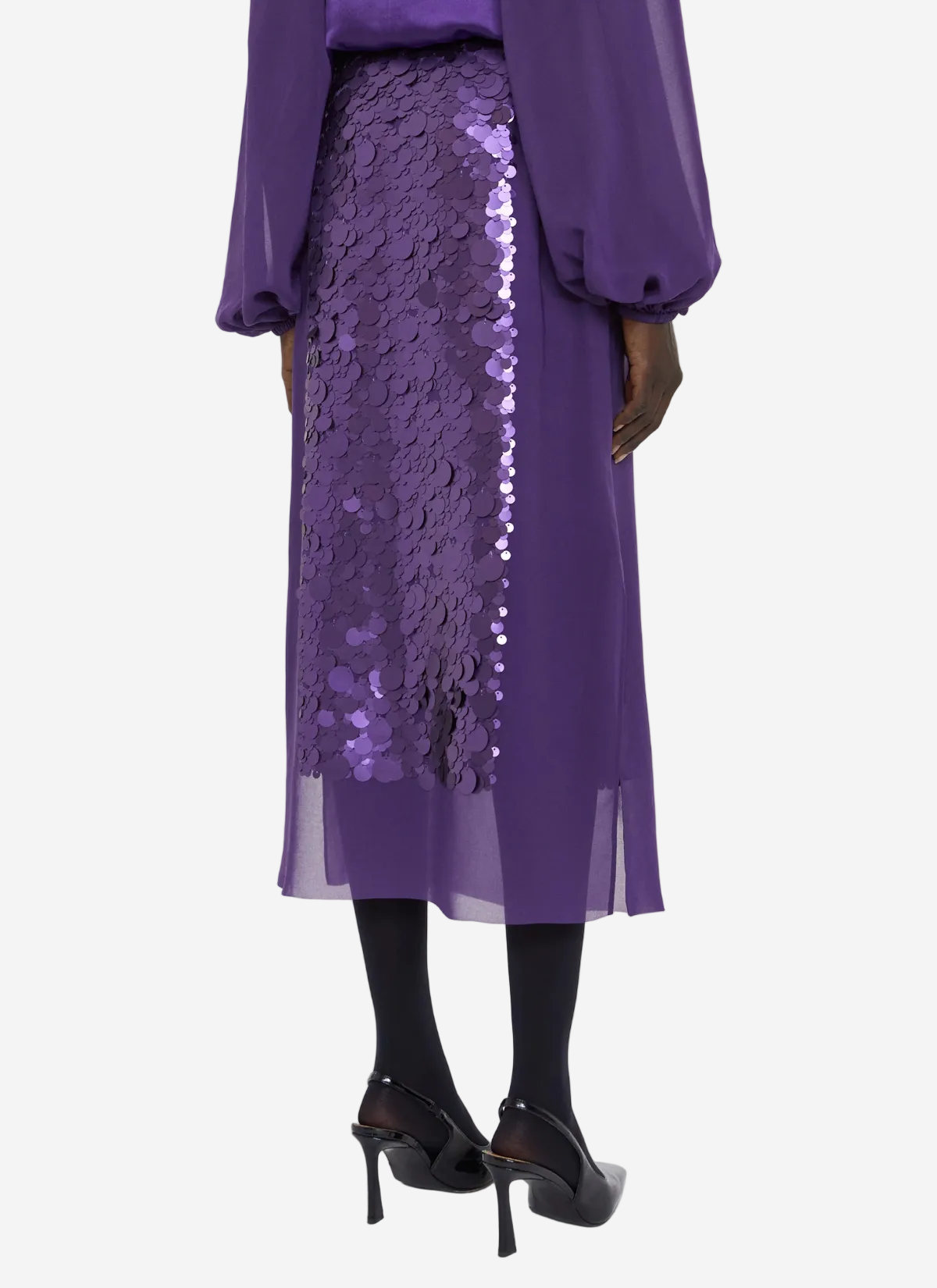 Purple outfit with a sequined skirt on a white background
