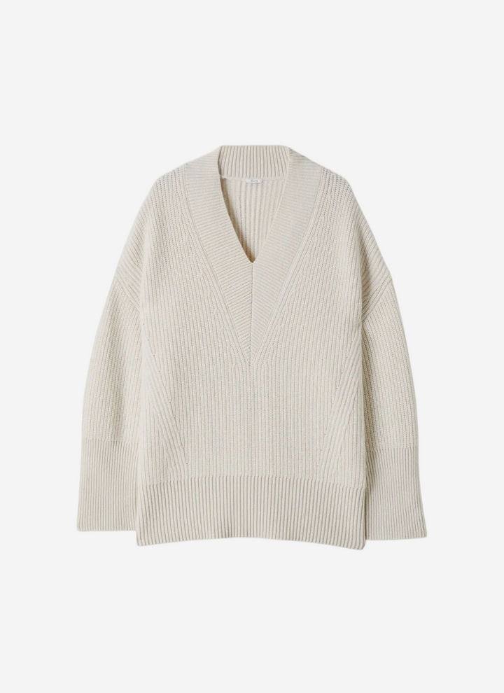 Beige ribbed sweater on a white background