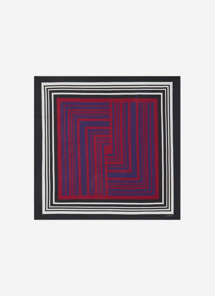 Framed artwork with a geometric pattern of red and blue lines on a white background