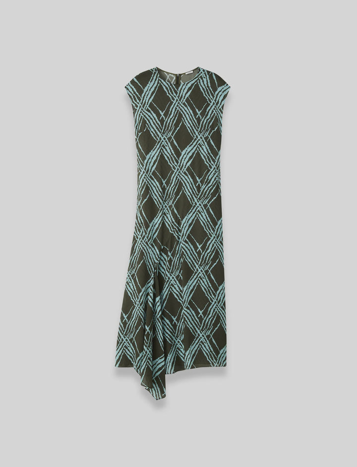 Green and black patterned dress on a light grey background at Christensen Copenhagen