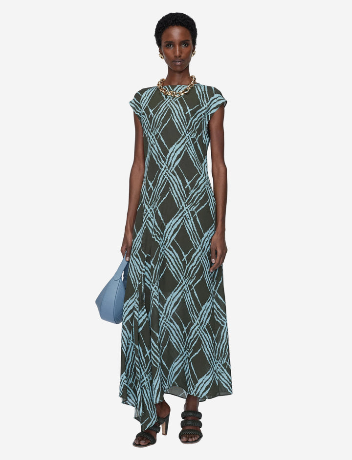 Model wearing a patterned dress on a white background avail in Australia at Christensen Copenhagen