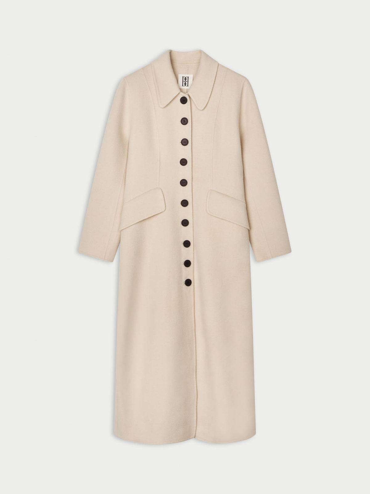 A light beige long coat by Malene Birger with a pointed collar, three-quarter sleeves, and a front button closure, shown against a light gray background.