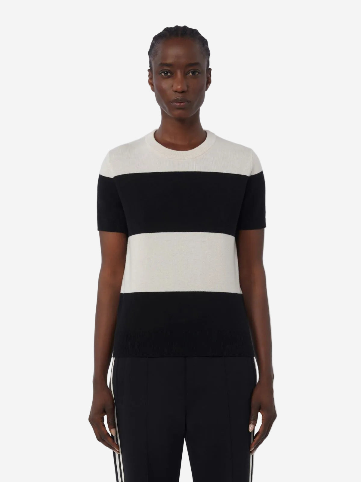 Woman wearing a black and white striped shirt on a white background