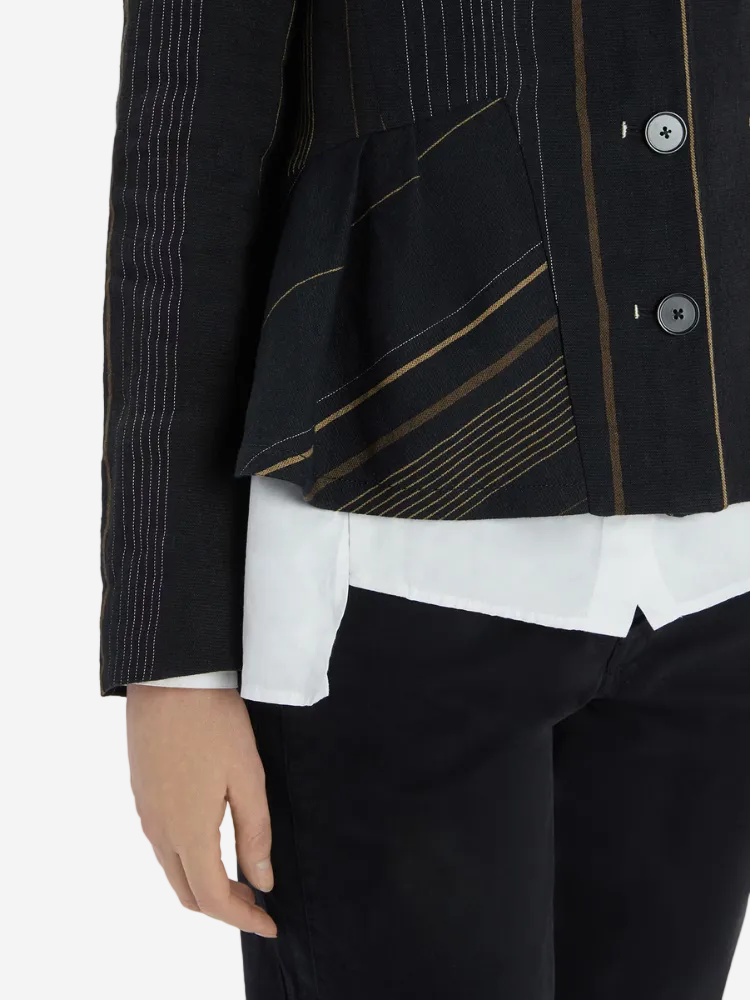 Black jacket with gold accents worn over a white shirt and black pants on a white background