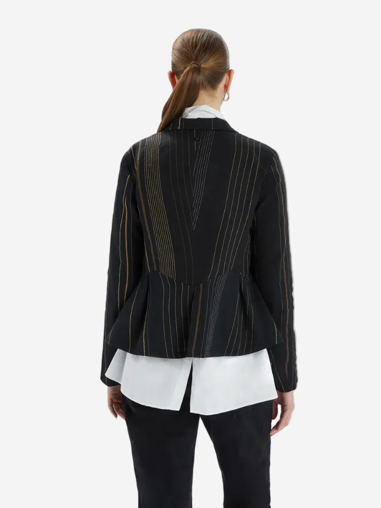 Back view of a wman in a stripe jacket