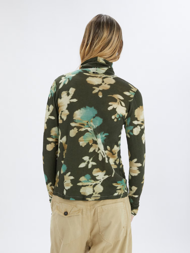 Person in a patterned top at Christensen Copenhagen
