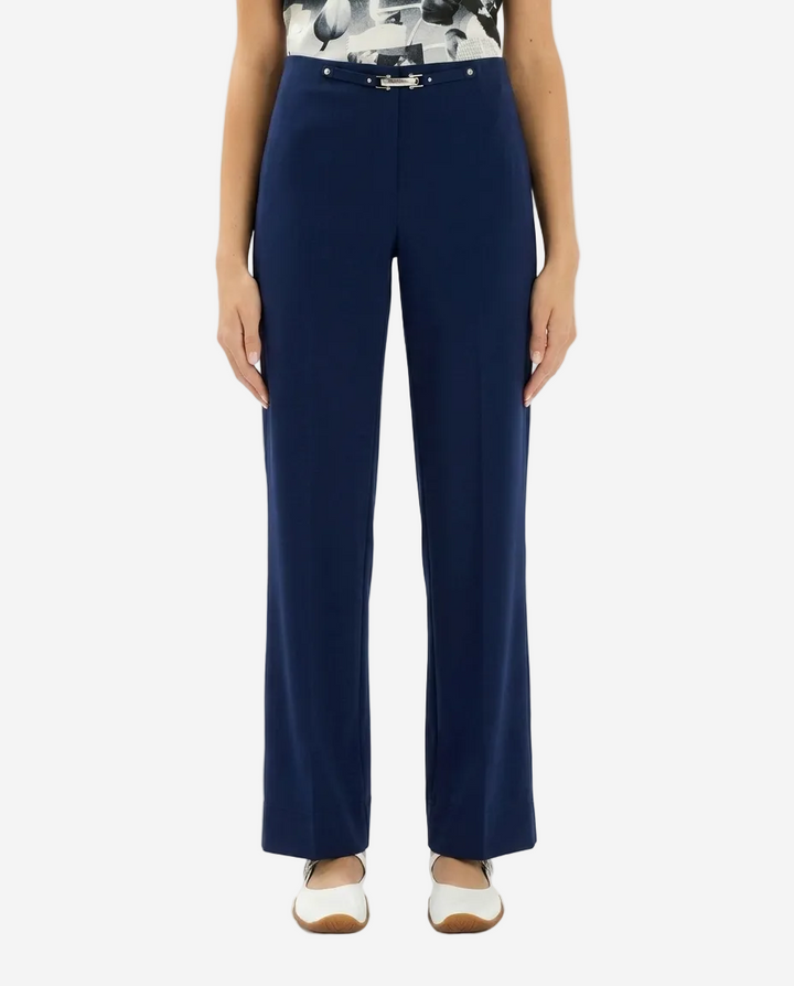 Navy blue pants worn by a person on a white background