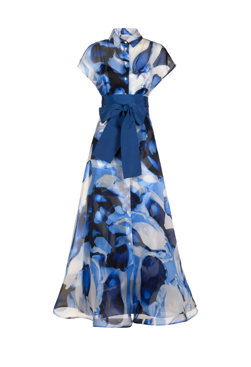 Blue patterned maxi dress against white background