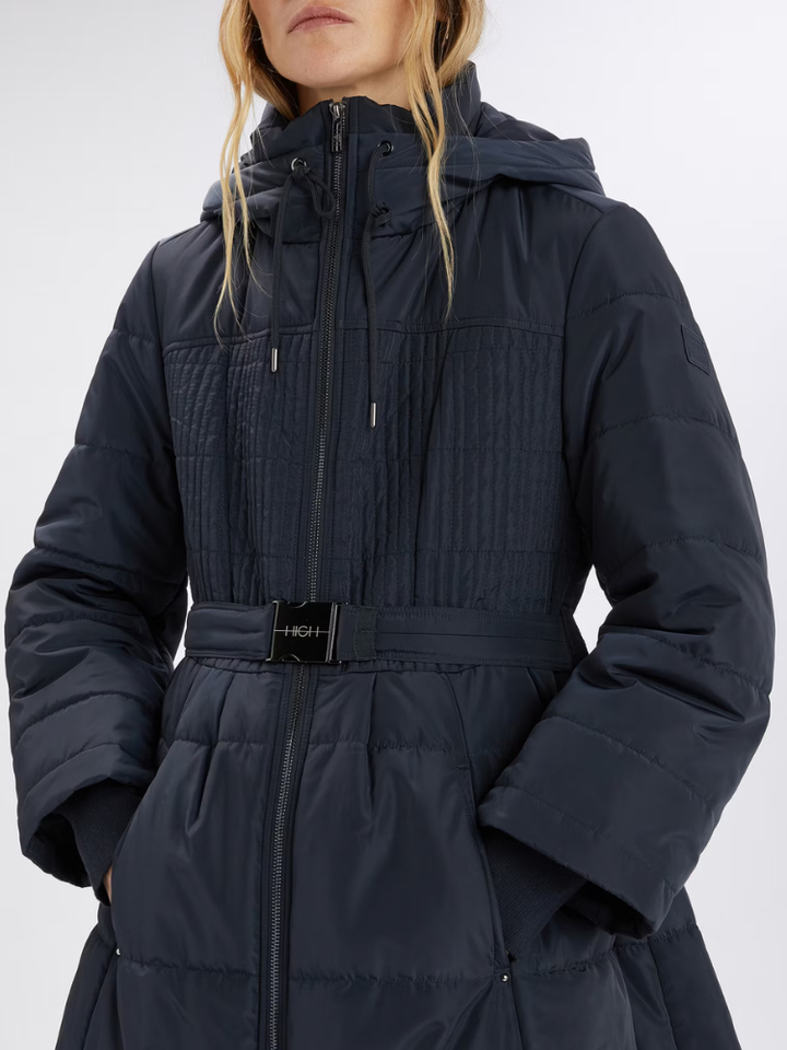 Women wears a padded navy jacket