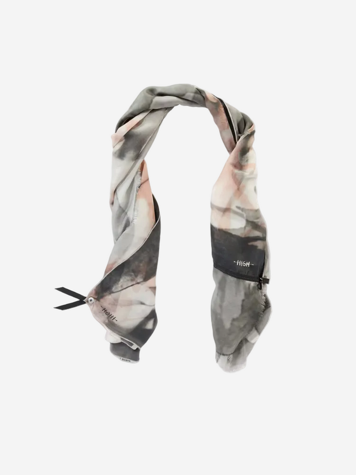 Marble patterned scarf with a brand label on a white background