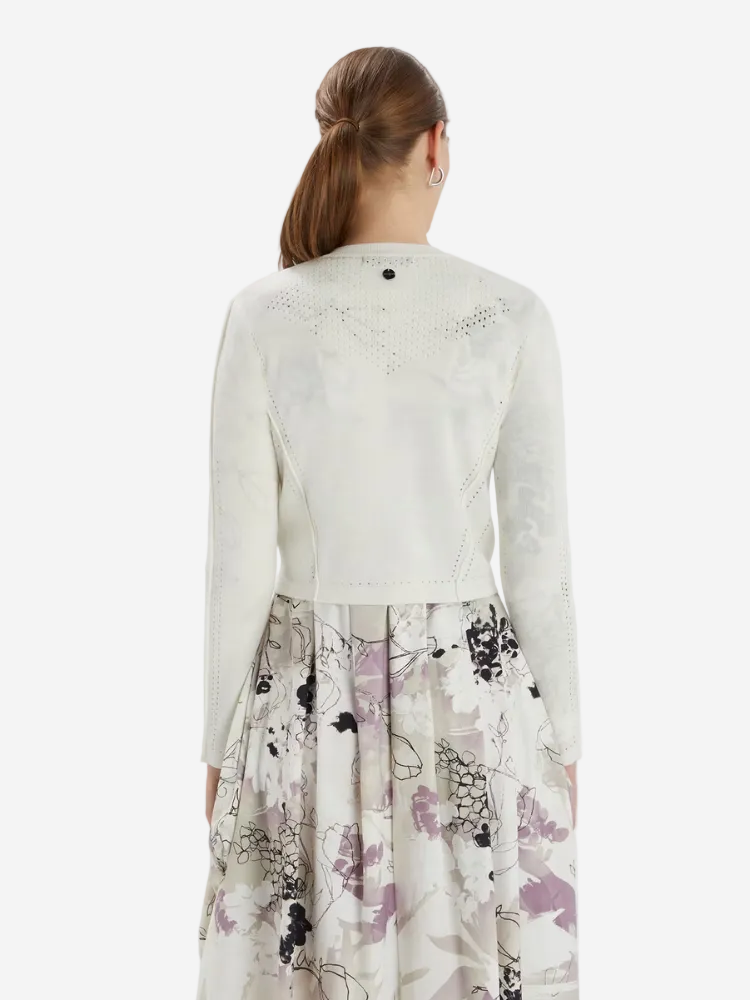 woman in a white cardigan and dress