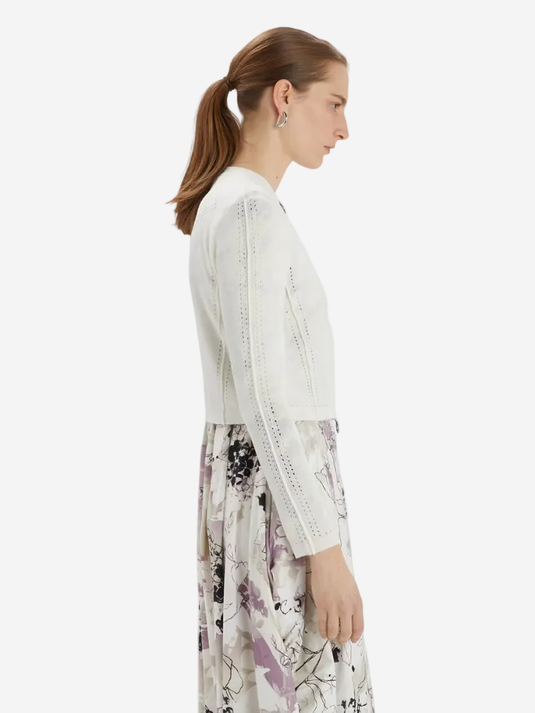 woman in a white cardigan