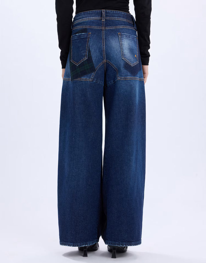 Back view of the HIGH Snowdrift wide-leg jeans in navy denim with green tartan pocket detail