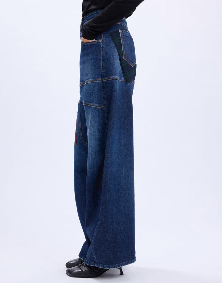 Side view of the HIGH Snowdrift palazzo jeans showing the full wide leg and frayed hem