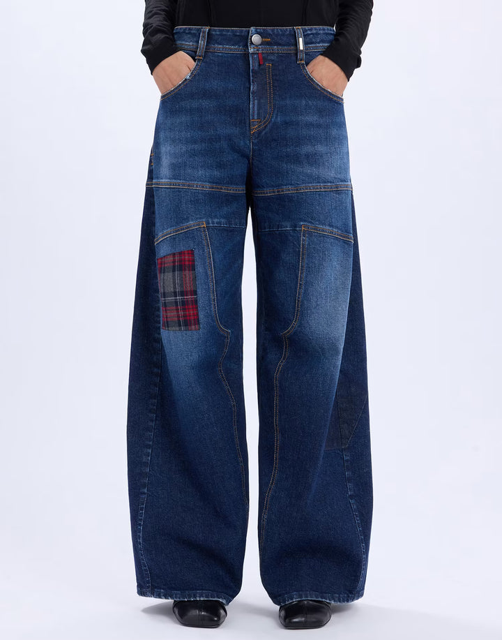 Front view of the HIGH Snowdrift wide-leg jeans in navy denim with red tartan patch and panelled seams