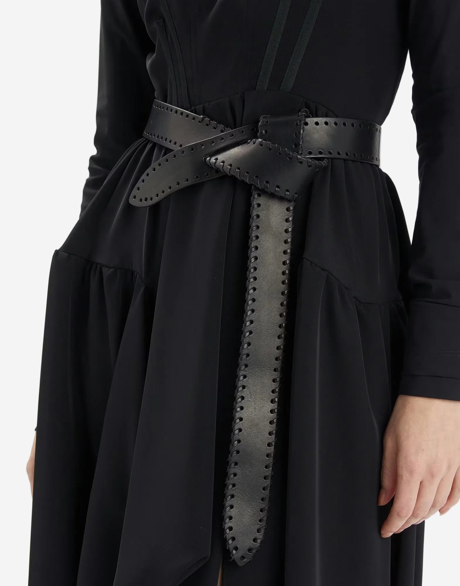 Black dress with a studded belt on a white background