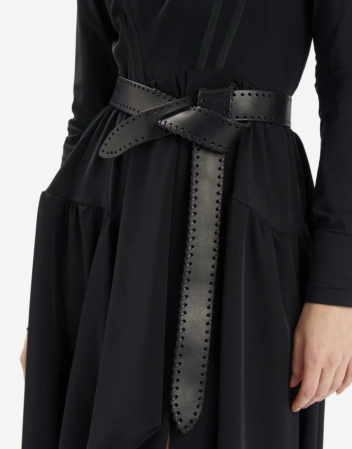 Black dress with a studded belt on a white background