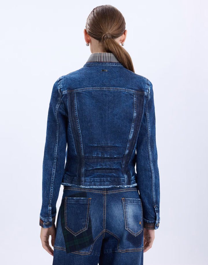 A model shown from the back wearing a dark blue denim jacket with a striped collar and matching dark blue denim jeans against a plain white background.