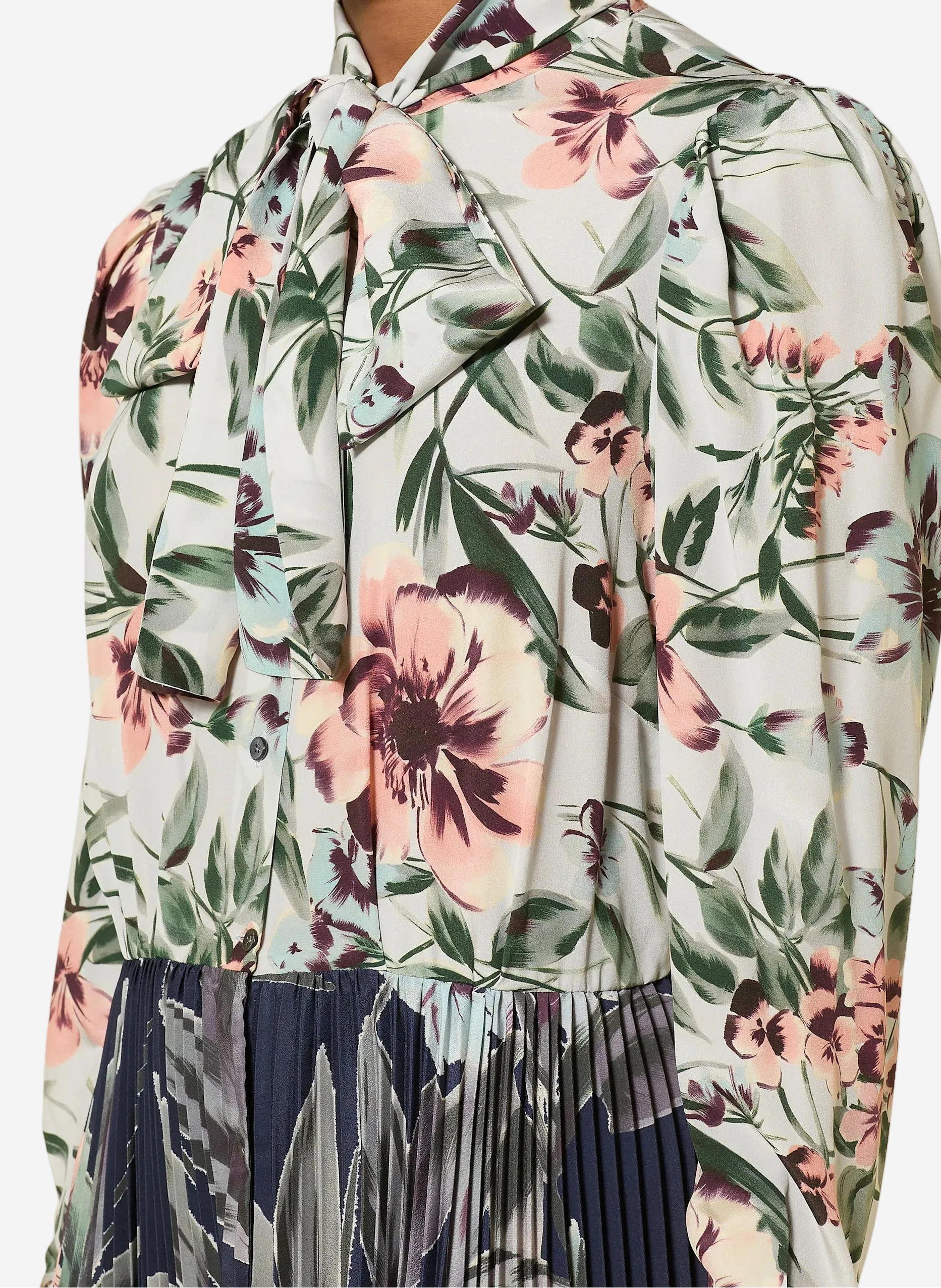 Woman wearing a floral blouse with a white background