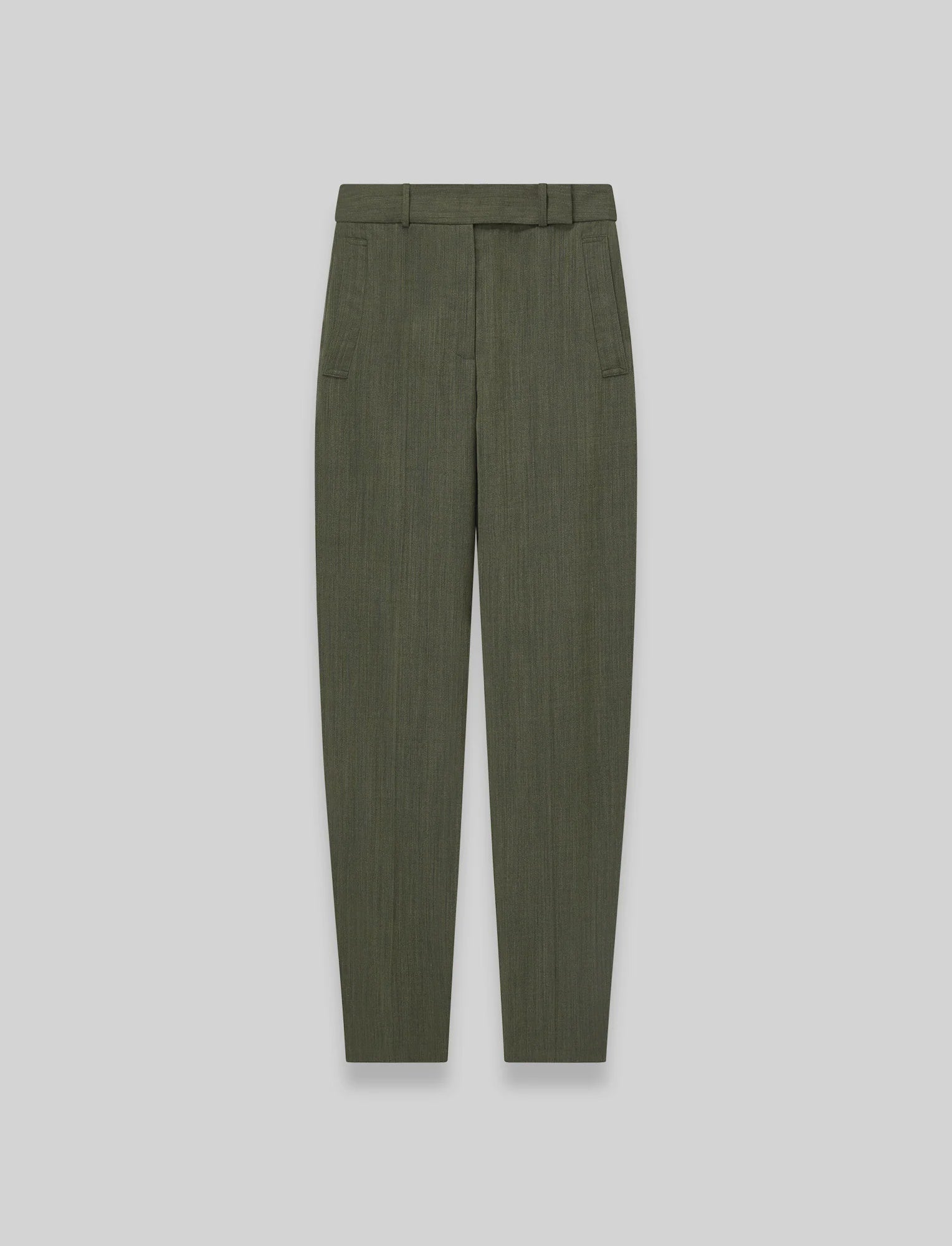 Green pleated pants on a light gray background