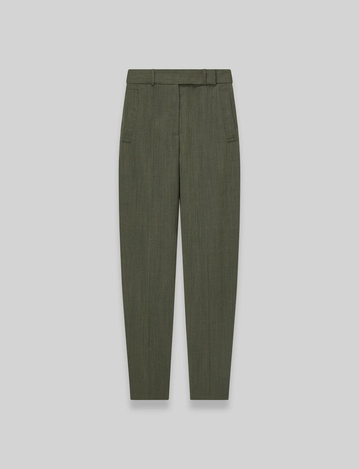 Green pleated pants on a light gray background